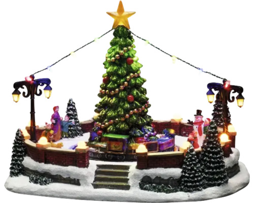 Decoratieve kerstscène met boom, figuren en verlichting