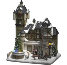 Kersthuis met zingende figuren, koets en kerstboom als decoratie