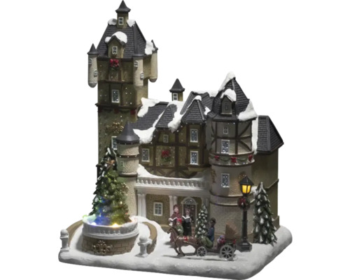 Kersthuis met zingende figuren, koets en kerstboom als decoratie