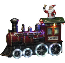 Decoratieve kersttrein met kerstmanfiguur en verlichting als feestelijke decoratie