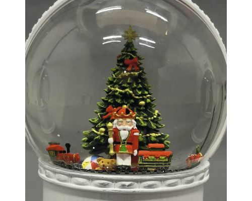 Sneeuwbol met notenkraker, kerstboom en speelgoedtrein