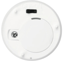 Onderkant van een ronde ledlamp met batterijvak en schakelaar