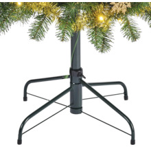 Metalen kerstboomstandaard met boom en decoratie