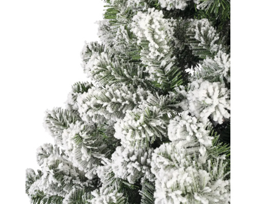 Close-up van een kunstmatige, besneeuwde kerstboom