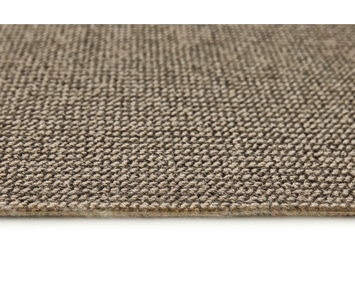 Close-up van een beige tapijt met textielstructuur