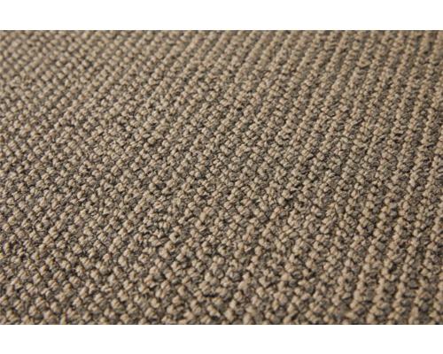 Detailopname van een beige tapijtvloer.