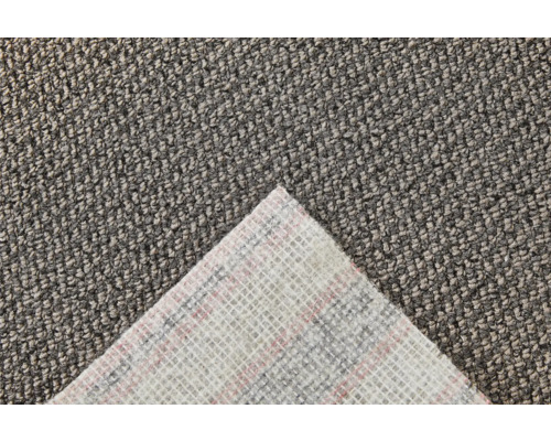 Close-up van een grijze tapijttegel met textielrug