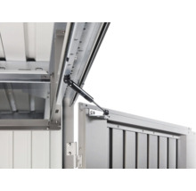 Detailaanzicht van een geopende metalen box met gasveer