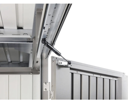 Detailaanzicht van een geopende metalen box met gasveer