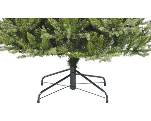 Detailopname van een kunstkerstboom met metalen voet