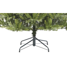 Detail van een kunstkerstboom met metalen voet