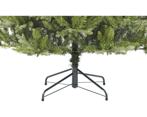 Detail van een kunstkerstboom met metalen voet
