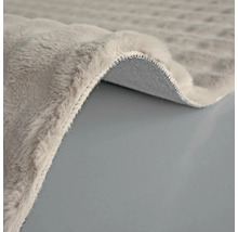 Detailweergave van een grijs tapijt met pool