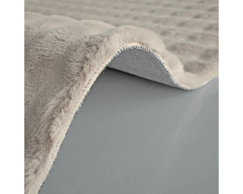 Detailweergave van een grijs tapijt met pool