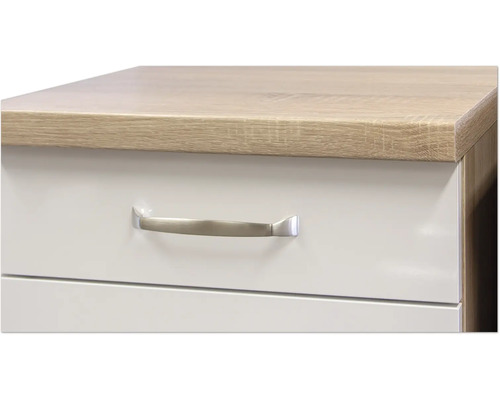 Detailopname van een meubel met lades en een handgreep