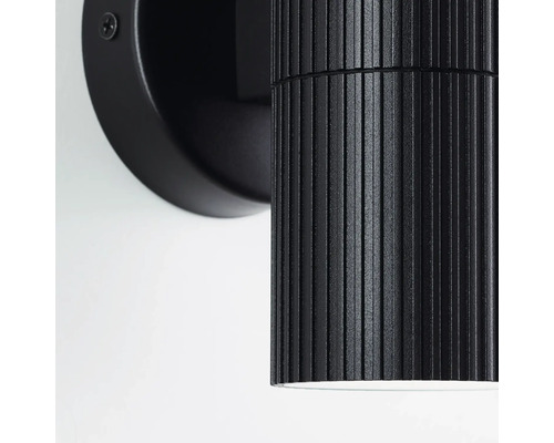 Zwarte wandlamp met geribbeld design voor binnenshuis