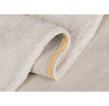 Detailopname van een licht badtapijt met zacht oppervlak