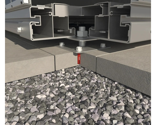 Detail van een onderconstructie op een stenen fundering, bevestigd met schroeven en pluggen, omgeven door grind.