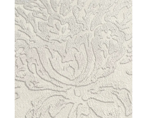 Close-up van een gestructureerd behang met een bloemmotief