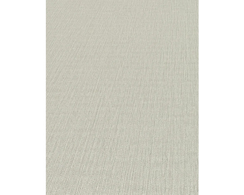 Detailopname van een beige structuurbehang.