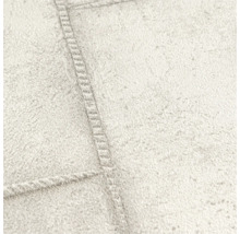 Close-up van een gestructureerd behang met een naadpatroon