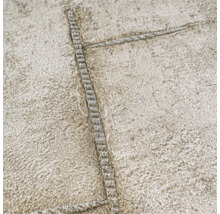 Close-up van een gestructureerd behang met stikselpatroon