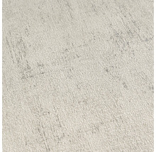 Close-up van een lichtgekleurd, gestructureerd behang met fijne patronen