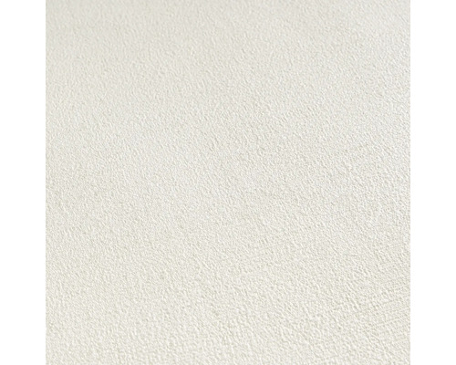 Close-up van een wit vliesbehang met fijne structuur