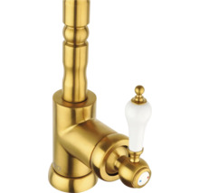 Goudkleurige wastafelkraan met witte handgreep