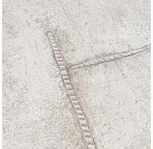 Detailopname van een behang met jeansstikselmotief