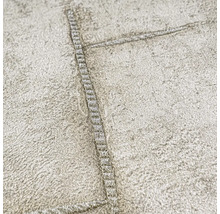 Close-up van een gestructureerd behang met stikselpatroon