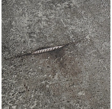 Close-up van een grijs oppervlak met een kras