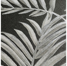 Close-up van een gestructureerd behang met bladerenmotief