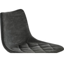 Detailopname van een stoel met gestoffeerd zitgedeelte