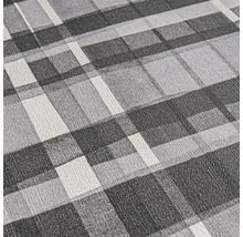 Close-up van een gestructureerd behang met geometrisch patroon