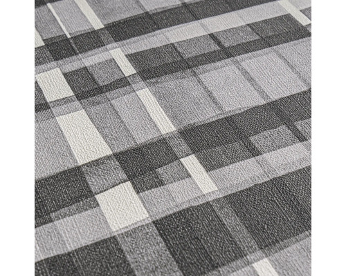 Close-up van een gestructureerd behang met geometrisch patroon