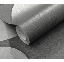 Een rol behang met een abstract cirkeldesign.