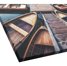 Canvas schilderij met houten boten aan een steiger