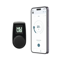 Huum bedieningseenheid en smartphone met Huum app voor verwarmingsregeling