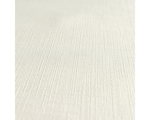 Close-up van een lichtgekleurd, gestructureerd behang.