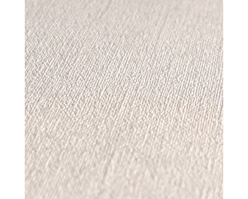 Close-up van een wit textielbehang met fijne structuur