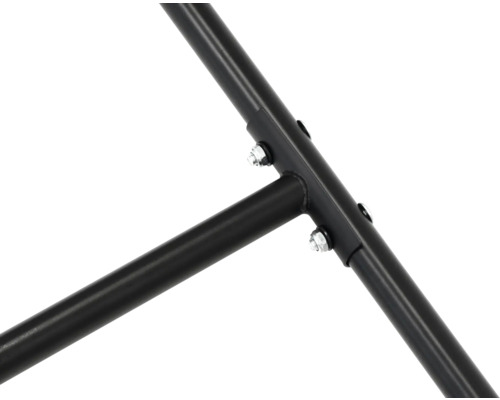 Detailopname van een metalen frame, vastgemaakt met schroeven.