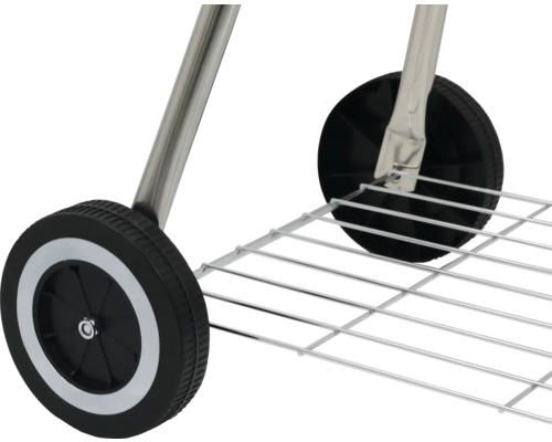 Detail van wielen en opbergrooster van een barbecue.