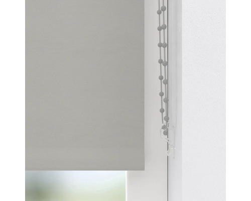 Grijs rolgordijn in het raam