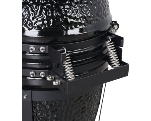 Detailopname van een keramische barbecue met veermechanisme