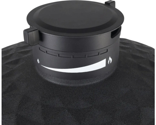 Close-up van de ontluchtingsklep van een barbecue met een instelindicator