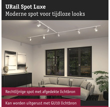 URail Spot Luxe railsysteem met meerdere spots in een woonkamer.