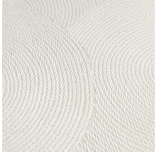 Close-up van een wit structuurbehang met cirkelvormig patroon