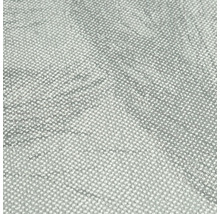 Close-up van een grijs textielbehang met stippenpatroon