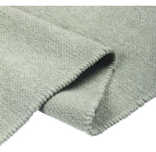 Detailweergave van een grijs tapijt met textuur